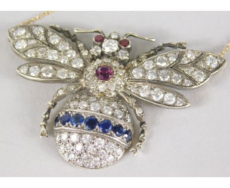 A bee necklace, the bee set with round brilliant rubies, sapphires and diamonds, the lower body with pave set diamonds and a 