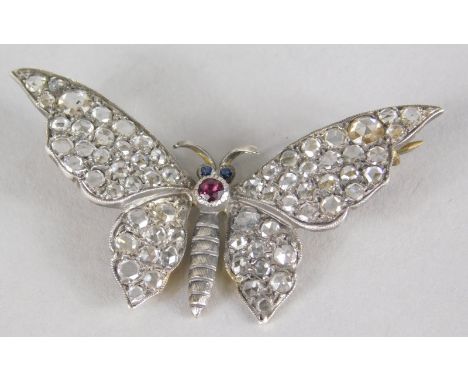 A butterfly brooch, set with diamonds, sapphires and a ruby, with diamond set wings, and sapphire eyes, and single ruby to bo