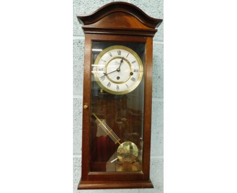 A Comitti of London mahogany cased wall clock, with enamel style dial, 58cm high