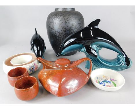 Various items of Poole pottery etc., to include a black egg shell type glazed vase, two dolphins, posy ring and a Studio type