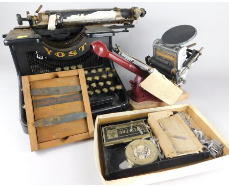 An Adana portable printing press, with various accessories, to include extra lettering etc. and a portable typewriter
