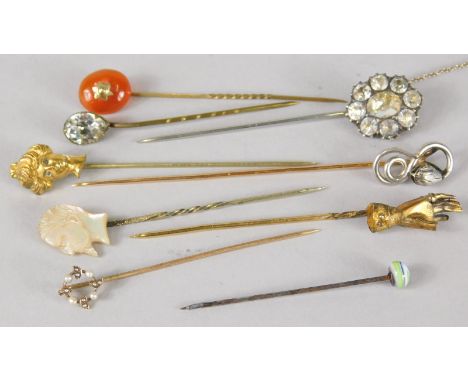 A collection of nine stick pins, to include some stone set, gold silver and others. 