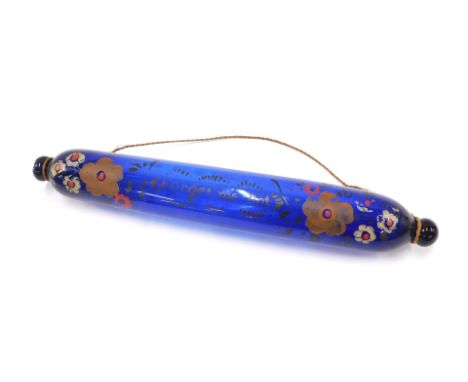 A Victorian Bristol blue glass rolling pin, with painted decoration inscribed Forget Me Not, 39cm wide. 