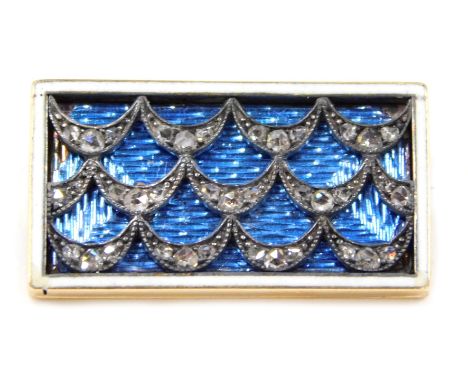 A late Victorian/early Edwardian bar brooch, of rectangular form, with white enamel border, an arched fan design set with tin
