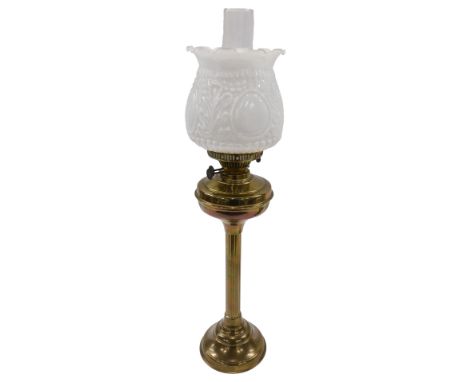 A brass column oil lamp, with opaque white shade, 70cm high.&nbsp;