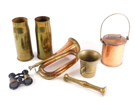 A collection of metalware, to include a brass pestle and mortar, copper and brass bugle, food container, shell cases, etc. 