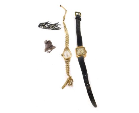 Two wristwatches, silver chain and brooch, comprising a Victoria 18ct gold lady's wristwatch, on black leather strap, a 9ct g
