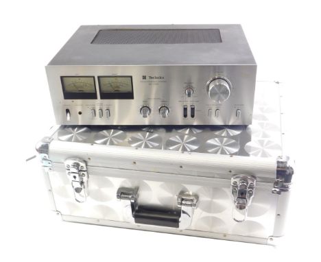 A Technics stereo integrated amplifier, SU-7300, in flight case. 