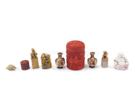 Various oriental ceramics, comprising a red lacquered and blue enamel lined jar and cover, 13cm high, various carved soapston
