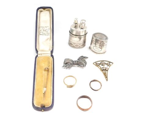A group of curios, comprising a silver plated powder flask, with engine engraved decoration, stamped GMJ, a marcasite set bow