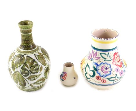 A Poole pottery vase, decorated with multicoloured flowers, 18cm high, another similar, and a Denby Glyn Colledge bottle shap