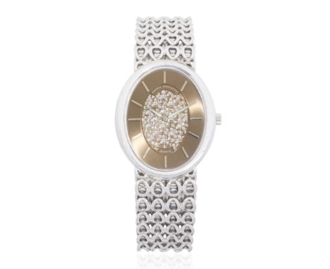 Patek Philippe. An 18K white gold manual wind bracelet watch with sigma dialModel: Golden EllipseReference: 3598/1Date: Circa