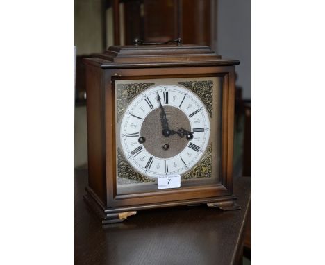 A German mantel clock, by Martime, silvered chapter ring, brass corner mounts, Roman numerals, three winding holes, chiming, 