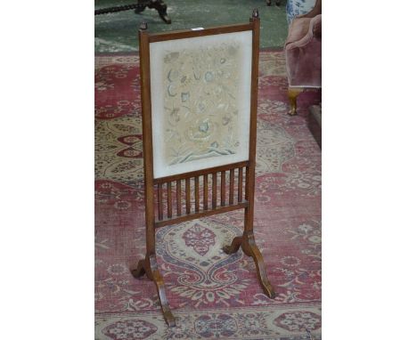 An Edwardian mahogany firescreen, carved acanthus finials, c.1905