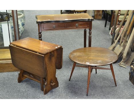 An Ercol elm gate leg side table; an oak dropleaf table, of small proportions; a mahogany side table (3)