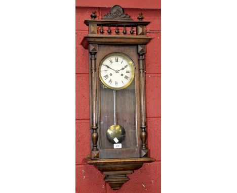 A Waldgong German wall clock, brass dial, Arabic and Roman numerals, glazed case, turned columns, c.1920