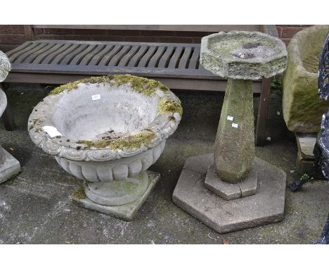 Garden ornaments -  a reconstituted stone planter on stand; a reconstituted bird bath (faults). (2)