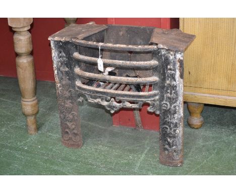 A cast iron bedroom fire grate, cast with foliage, c.1900

