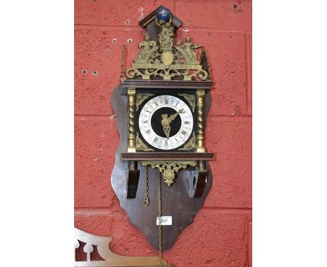A Dutch style wall clock, brass mounted, with two pear shaped weights