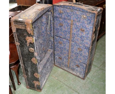 A vintage cabin trunk with various labels including the troop ship  MV Asturias which was later used by people emigrating to 