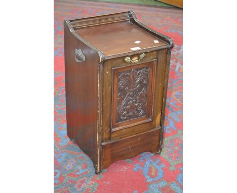 An Edwardian mahogany purdonium, three quarter galleried top, carved fall front, metal liner, ceramic casters.