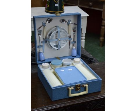A Brexton picnic hamper, fitted, with Fiesta pattern ceramic transfer printed cups, saucers and tea plates