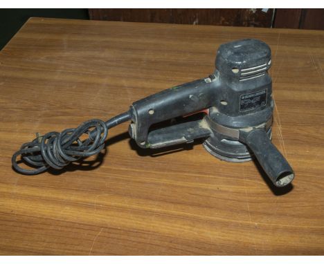A Black &amp; Decker orbital sander