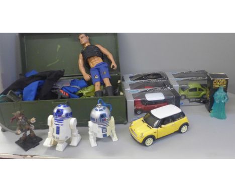 An Action Man figure with a collection of clothes and accessories and a collection of model cars (some boxed), toys, etc. 