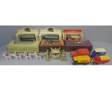 A box of die-cast model vehicles including Days Gone, Thunderbird 2, etc. 