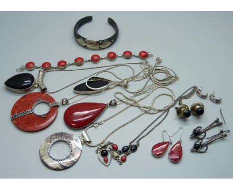 A collection of silver jewellery, many pieces set with coral including pendants, a bracelet, earrings etc., 115g of stone set