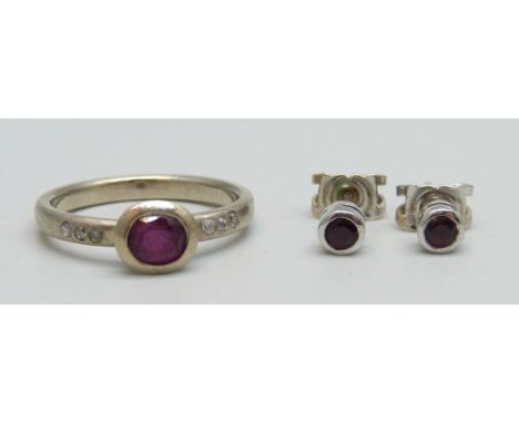 A 14ct white gold, diamond and ruby ring, M, and a pair of 18ct white gold and ruby stud earrings, 4.8g total 