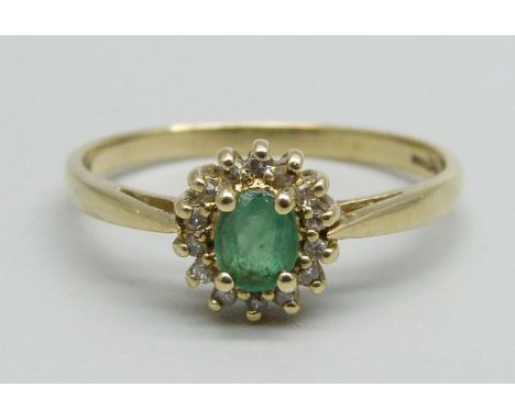 A 9ct gold, emerald and diamond cluster ring, 2.2g, U 