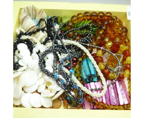 Mother of pearl and haematite necklets and amber coloured jewellery 