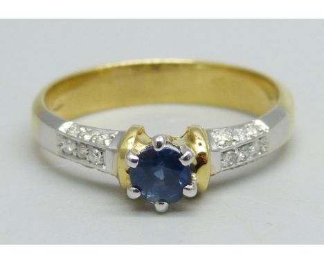 An 18ct gold, sapphire and diamond ring, 18 diamonds on three sides of shoulders, 4.1g, P/Q 