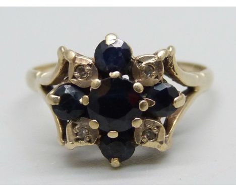 A 9ct gold, sapphire and diamond ring, one sapphire loose in setting (claw a/f), 2.9g, R 