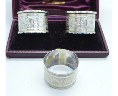 A pair of silver napkin rings and one other silver napkin ring, 67g 