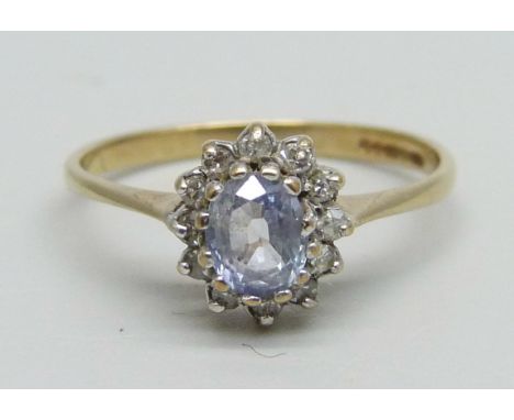 A 9ct gold cluster ring set with a light purple stone and small diamonds, 1.4g, L 