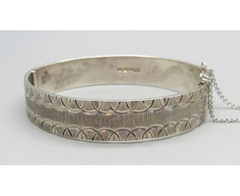 A silver bangle, Monomil Ltd., Birmingham, 1976, 35g 