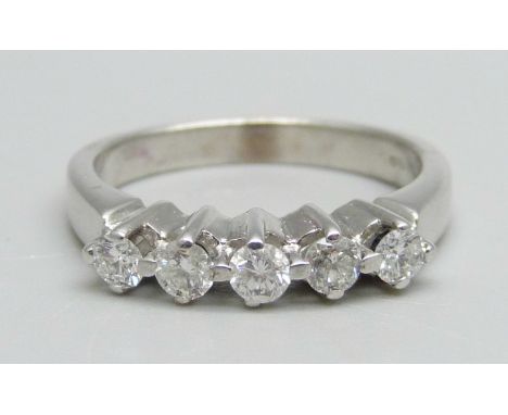 An 18ct white gold ring set with five diamonds, 5g, O 