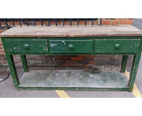 A vintage green painted and pine dresser, three short drawers, the square legs united by an under-tier, lower part painted gr