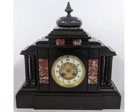 A late Victorian black slate mantle clock of architectural form and striking on a gongLocation: 