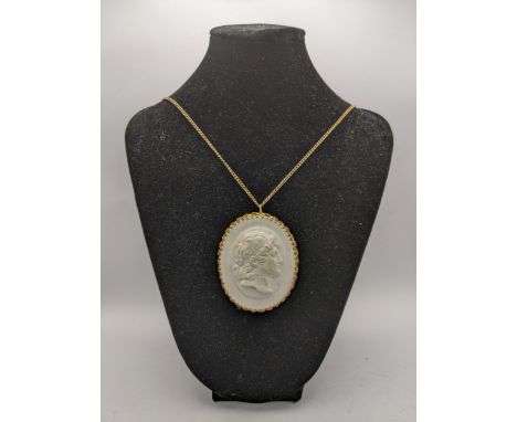 A yellow metal chain, clip and circular surround set with a Meissen porcelain tablet with a side portrait of a manLocation: C