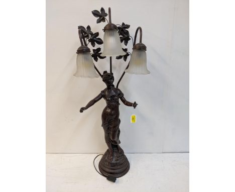 A reproduction of a bronzed finished Art Nouveau style table lamp, fashioned as a woman with three glass shadesLocation: A1M 