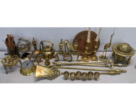A mixed lot of brassware to include fireside irons, barometer, fire dogs, trench art and other itemsLocation: 