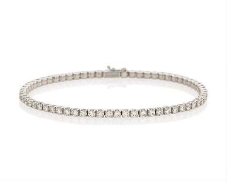 TENNISARMBAND. Material: 750/- Weißgold, Punze. Gesamtgewicht: ca. 15,0 g. Maße: Länge 21,0 cm. Diamanten: 65 Brillanten zus.