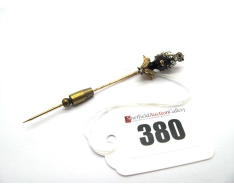 An Enamel and Diamond Set Blackamoor Stickpin, set with rose cut stones.