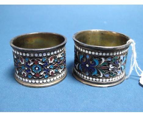 A Pair of Russian Enamel Napkin Rings, stamped "84" and makers initials, highlighted in blues, green, orange and white. (2)