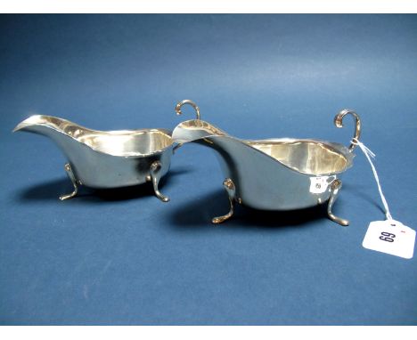 A Pair of Hallmarked Silver Sauce Boats, SH&amp;Co, Sheffield 1932, each with wavy cut edge and flying scroll handle, raised 