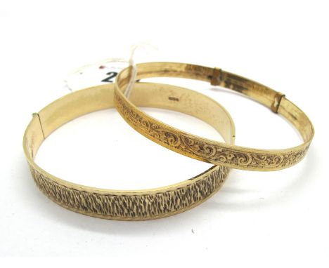 A 9ct Gold Bangle, of uniform bark textured design, to concealed clasp; A "9ct Rolled Gold" Expanding Bangle, allover leaf sc