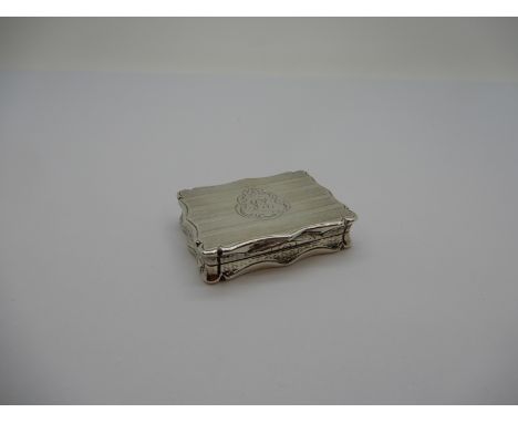 A Hallmarked Silver Vinaigrette, Nathaniel Mills, Birmingham 1854, of shaped rectangular form gilt lined, with leaf scroll pi